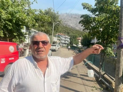 Bursa'da evine kadar ulaşan yangını g&ouml;zyaşlarıyla anlattı