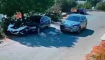Otomobiliyle k&ouml;peklerin &uuml;zerinden ge&ccedil;ti