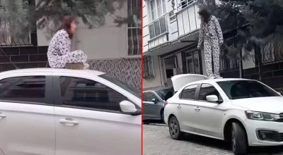 Sinir krizi ge&ccedil;iren kadın, bir otomobilin yolunu kesip &uuml;zerinde zıpladı
